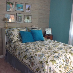 photo of bed and grasscloth wallpaper wall